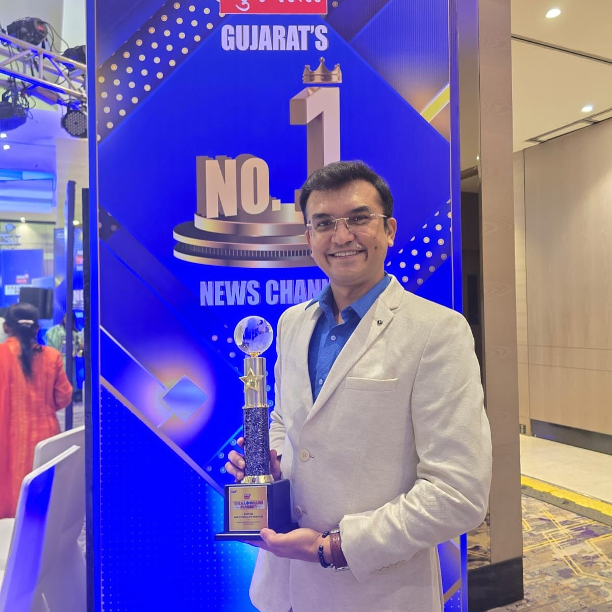 Dr. Alpesh Prajapati receiving an award