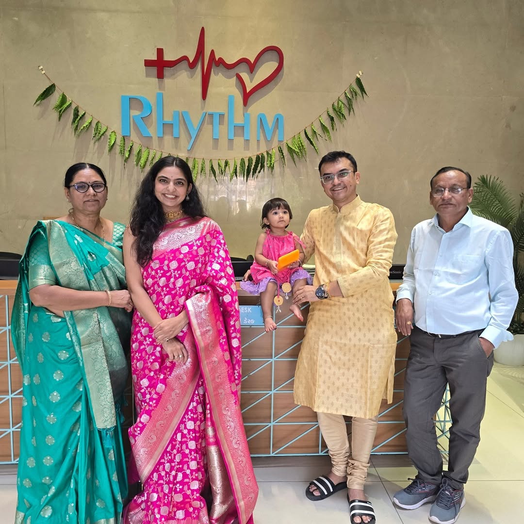 Dr. Alpesh Prajapati with his parents, wife, and daughter at Rhythm Hospital